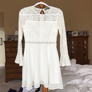 White mini lace dress with long sleeves